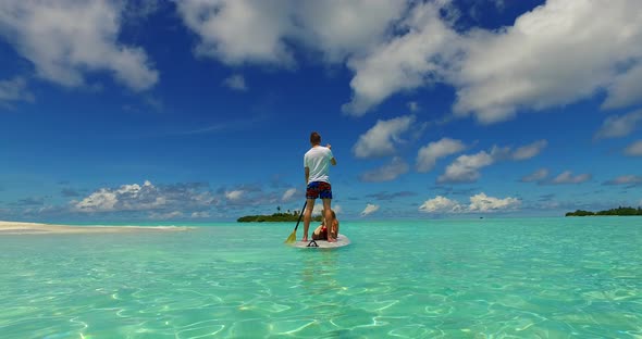 Fun lady and man in love dating on vacation enjoy life on beach on sunny white sandy background 4K alt