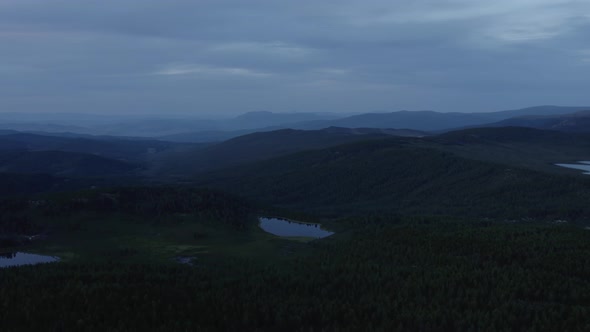 Dramatic sky and lakes in valley of Altai in evening time