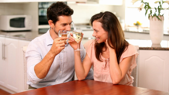 Happy Couple Drinking White Wine Together 1