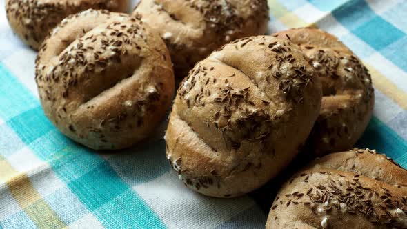 Bread rolls sprinkled with salt and caraway