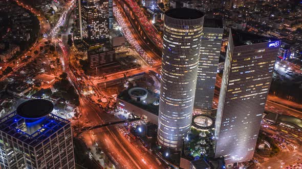 Night Tel Aviv business city center from birds view, Israel 4k aerial drone hyperlapse alt