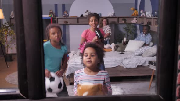 Funny Mixed Race Girls Fooling in Front of Window alt