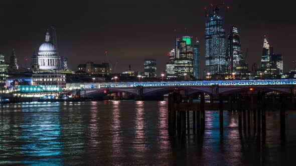 Blackfriars Bridge and Financial District with Illuminated Skyscrapers at night, London, UK alt