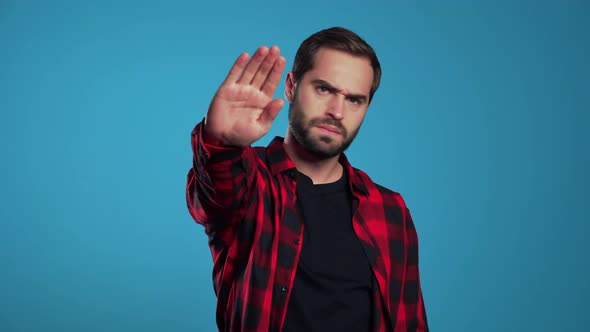 No, Never, Handsome Brunette Man Disliking and Rejecting Gesture By Stop Sign alt