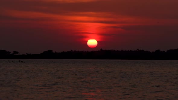 Zoom out of Sun with beautiful Red sky and sunset