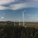 Camera Flight Over Landscape with Power Plant. Aerial View To Wind Turbine. Sustainable Electricity - VideoHive Item for Sale