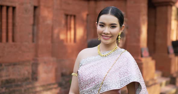 Portrait of Thai woman salute of respect in traditional costume of thailand alt