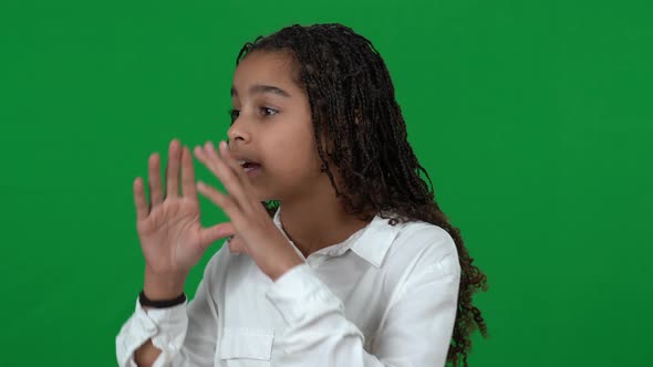 Closeup of Stressed Lost African American Teen Girl Shouting Calling for Help at Chromakey alt