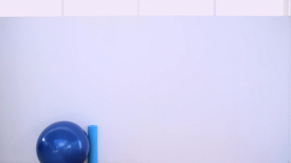 Fit Woman Walking And Drinking From Sports Bottle alt