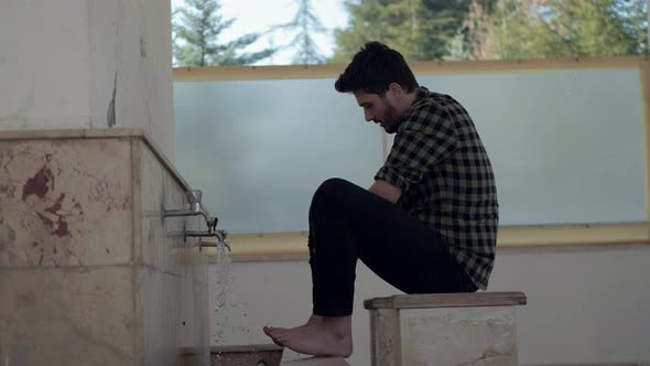 Young Muslim Man Taking Ablution for Prayer the Mosque alt