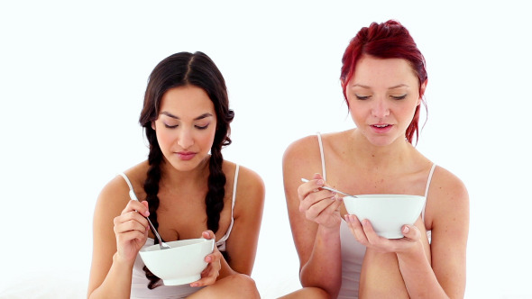 Gorgeous Young Women Eating Cereal For Breakfast
