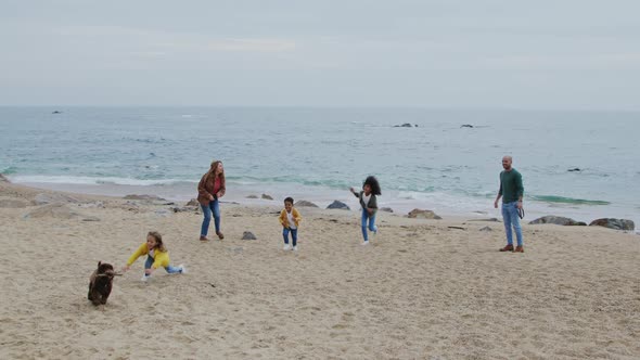 Young Family Outdoor Leisure On Beach
