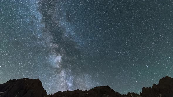 Time Lapse: the Milky way galaxy and stars rotation over the majestic Italian French Alps. Night sky alt