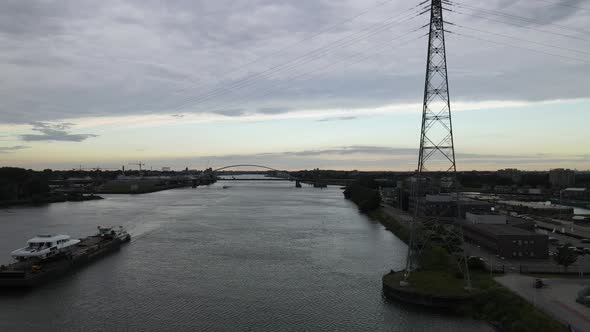 Pontoon Boat Transporting Part Of A Yacht Across Beneden Merwede River In Netherlands On A Cloudy Da alt