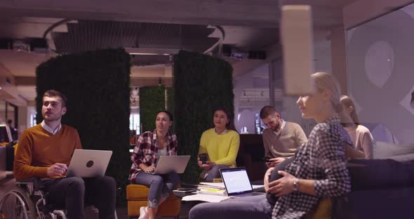 Muslim Woman in a Modern Open Space Coworking Office Giving a Presentation to Team alt