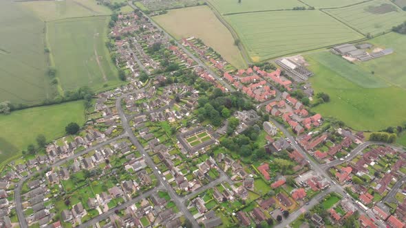 Aerial footage of the UK British town of Wheldrake located is in the City of York, West Yorkshire UK alt