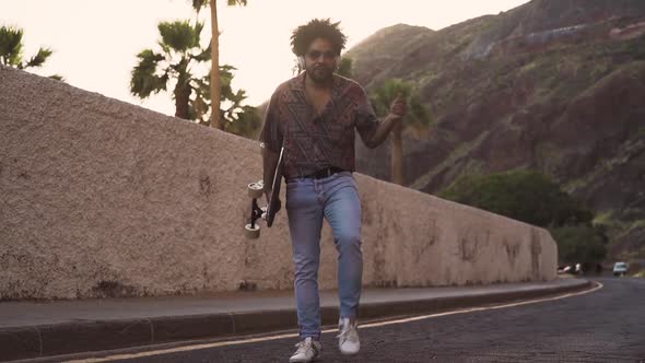 Happy Afro man having fun dancing alt