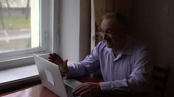 Elderly Man Uses Video Call on His Smartphone To Communicate Safely Communicate People Video Call alt