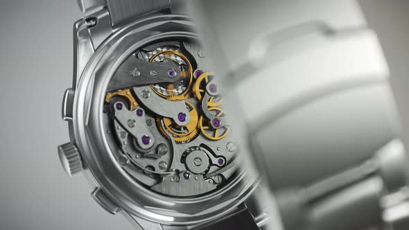 Closeup on the luxury watch with gears and mechanism visible through the glass. alt