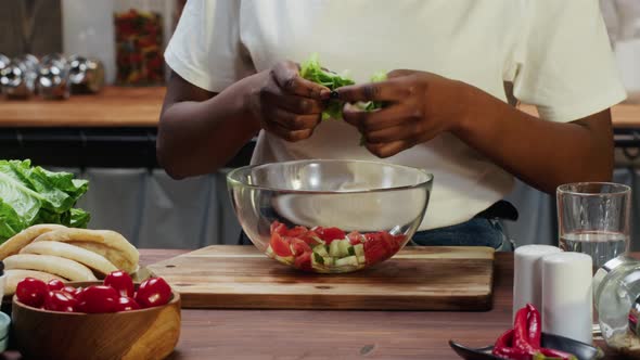 African American Chef Preparing Ingredients for Cooking Vegetable Salad alt