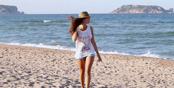 Woman Walking On The Beach alt