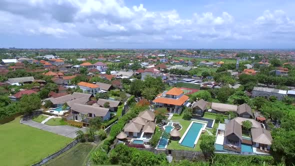 Aerial view of rice fields in the middle of a residential village, Indonesia. alt