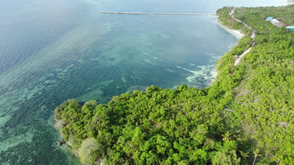 Aerial: Flying over tropical island, travel destination in Wakatobi National Par alt