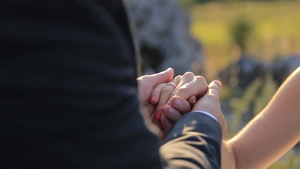 Beautiful Wedding Couple Kiss on the Sunset in the Mountains alt