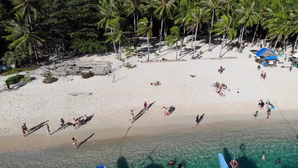  Aerial view of Tourists at the Beach alt