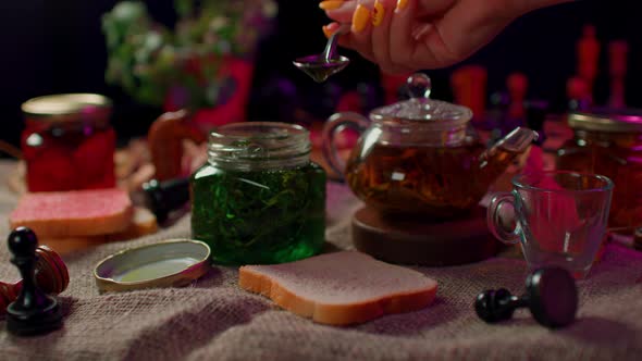 Closeup of Small Jar with Jam on Table alt