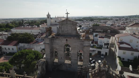Aerial view of Church facade against cityscape of Evora, Alentejo