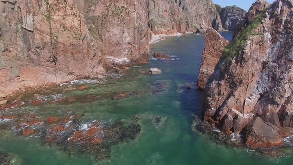 View From a Drone of the Coastline with a Rocky Coast and Rocks alt