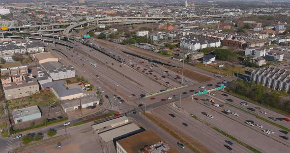 Establishing aerial shot of traffic on 59 South freeway near downtown Houston. alt