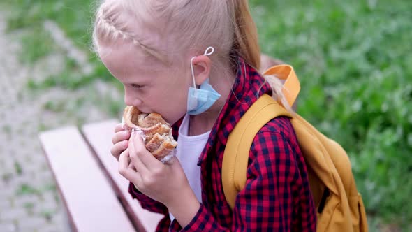 Back to School Girl Wearing Mask and Backpacks Protect and Safety From Coronavirus alt