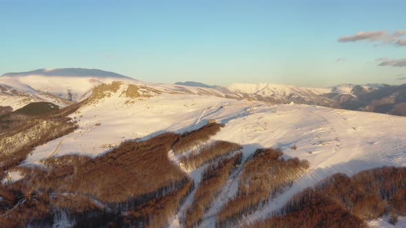 Aerial view at the mountain on a sunny winter day