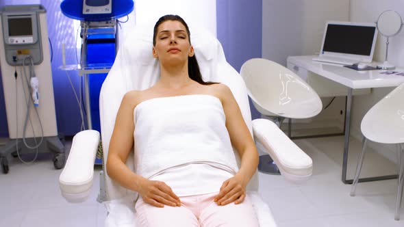 Female patient relaxing on surgical chair alt