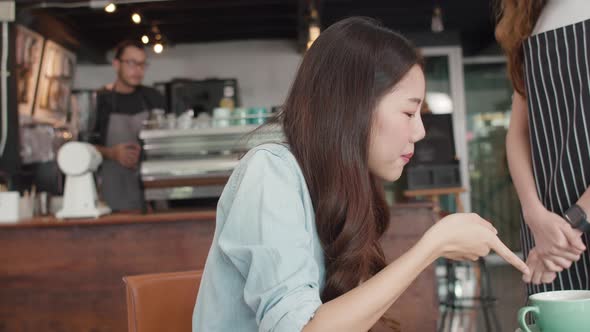 Asia freelance lady client talk dispute with millennial waitress feel dissatisfied with cafe. alt