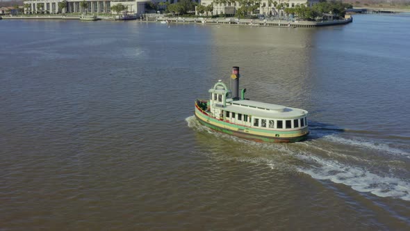 Tugboat heads solo down Savannah River approaching conference center alt
