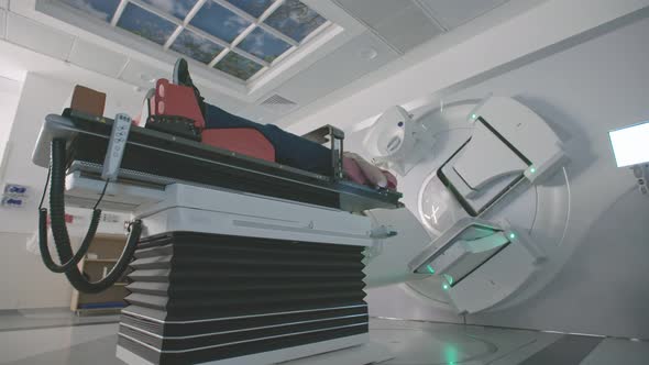 Patient Getting Radiation Therapy Treatment Inside A Modern Radiotherapy Room alt