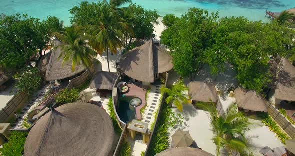 Aerial drone view of a couple at a spa resort hotel alt