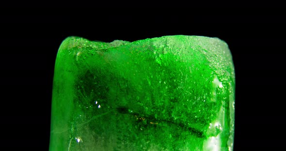 Green Ice glass melting. Timelapse.