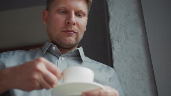 Young man by the window alt