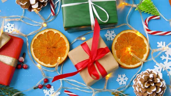 Christmas Gifts and Decorations on Blue Background  alt