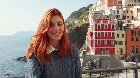 Tourist Girl Smiles and Has Fun in Riomaggiore City of the Cinque Terre alt