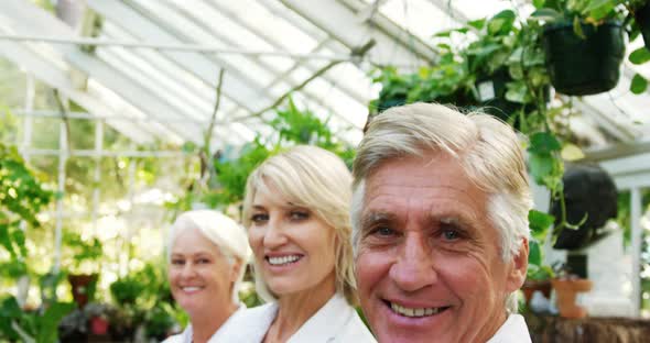 Portrait of scientists standing with arms crossed alt