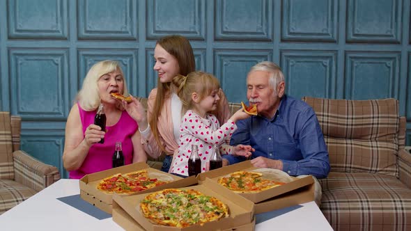 Happy Family Having Lunch Party Feed Each Other with Pizza Laughing Enjoying Meal Together at Home alt
