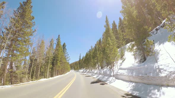 POV point of view -Driving through Rocky Mountain National Park in the Spring. alt