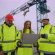Team of Architect Civil Engineer and Foreman in Construction Site Woman is Holding Laptop with - VideoHive Item for Sale