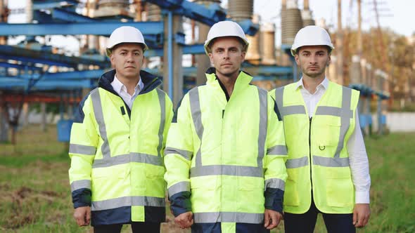 Portrait Group of Diverse Specialists Engineers with Safety Equipment Posing in Front of the Camera