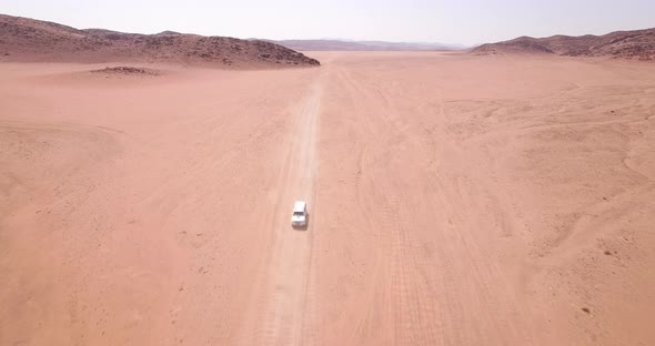 Vehicles Travel in Desert